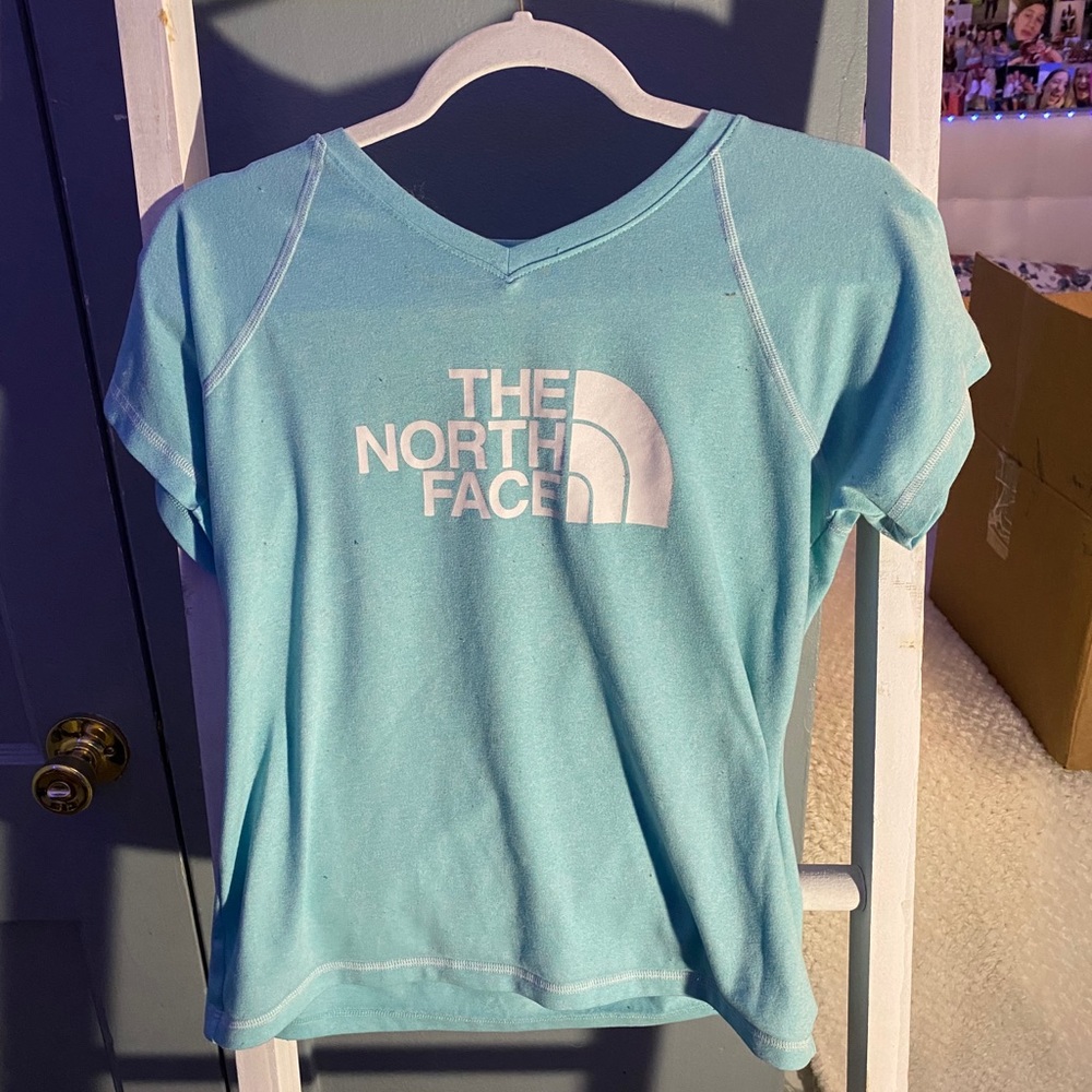 teal northface short sleeve shirt